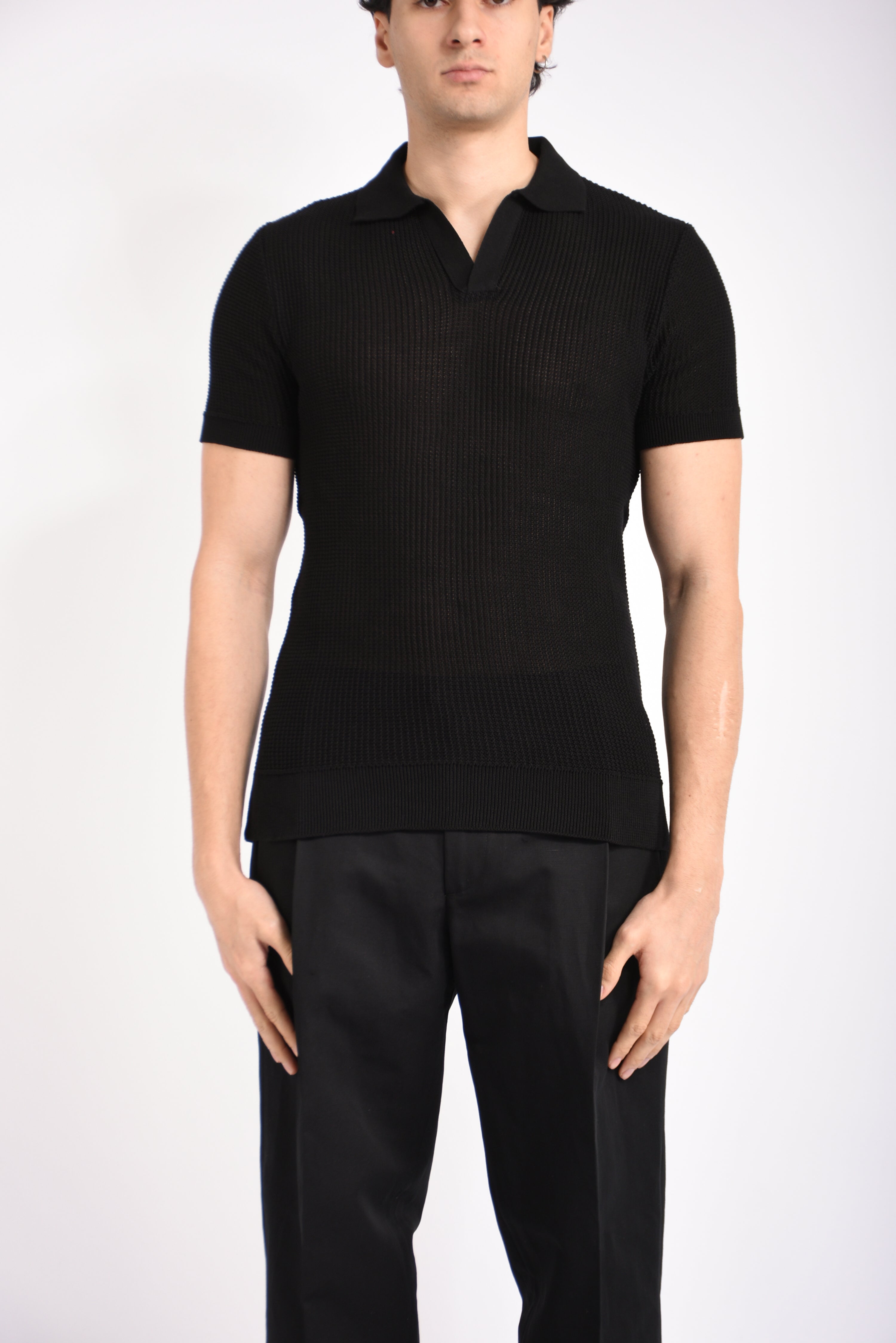 Polo traforata in cotone