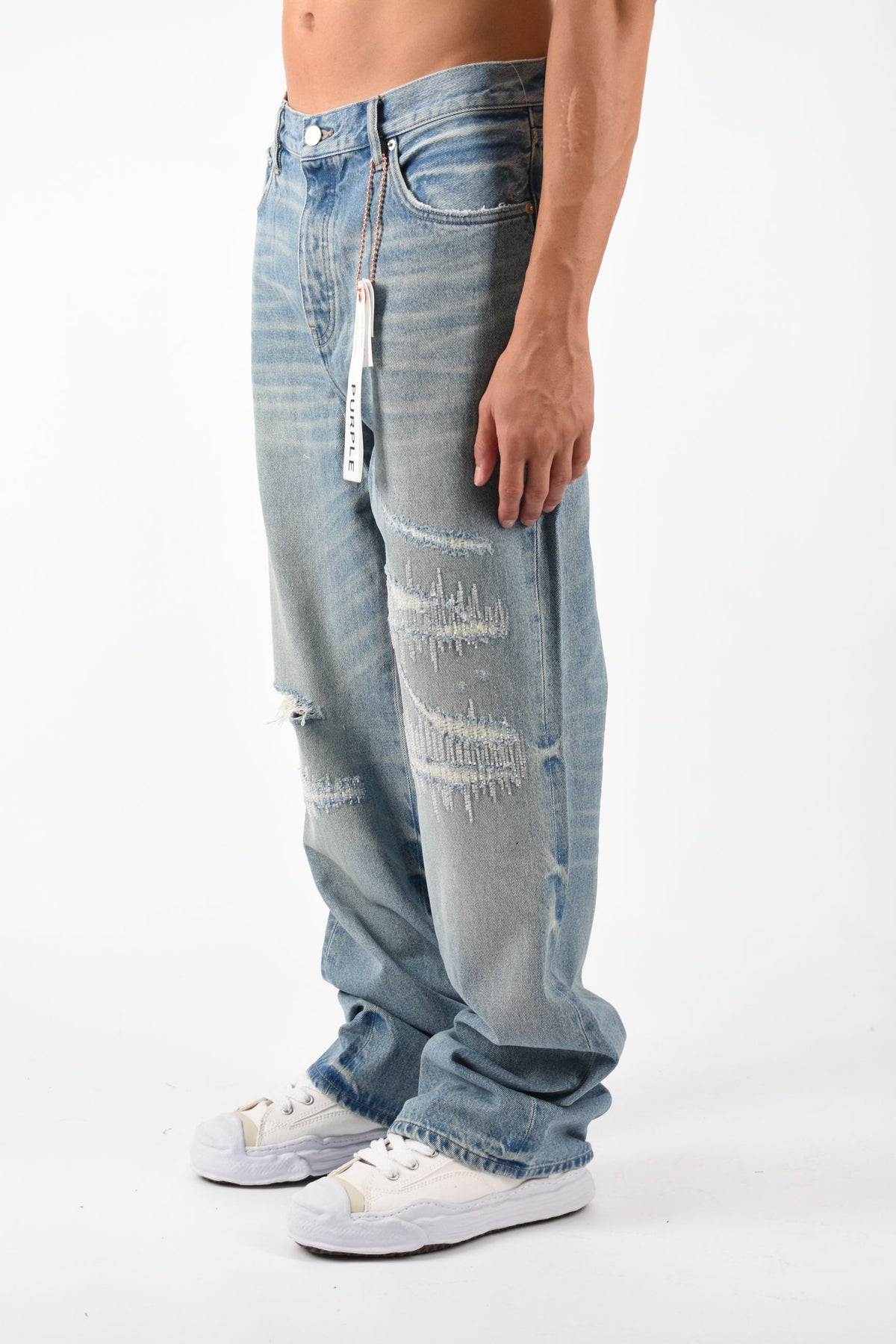 Jeans bootcut rip and repair